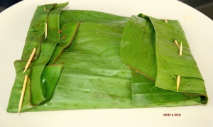 Wrap the fish in the banana leaf and secure with toothpicks